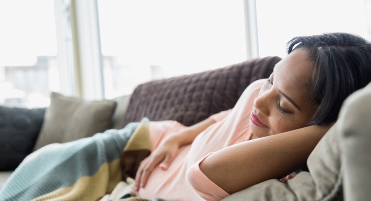 woman resting on couch